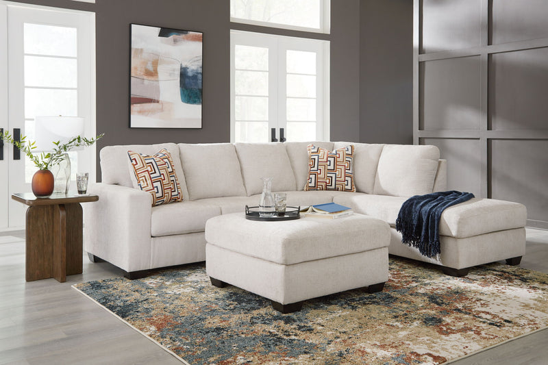Signature Design by Ashley Aviemore 3-piece sectional living room set with plush cushions and modern design.