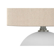 Cream ceramic table lamp with resin accents from 8th Street, featuring a contemporary design and smooth finish.