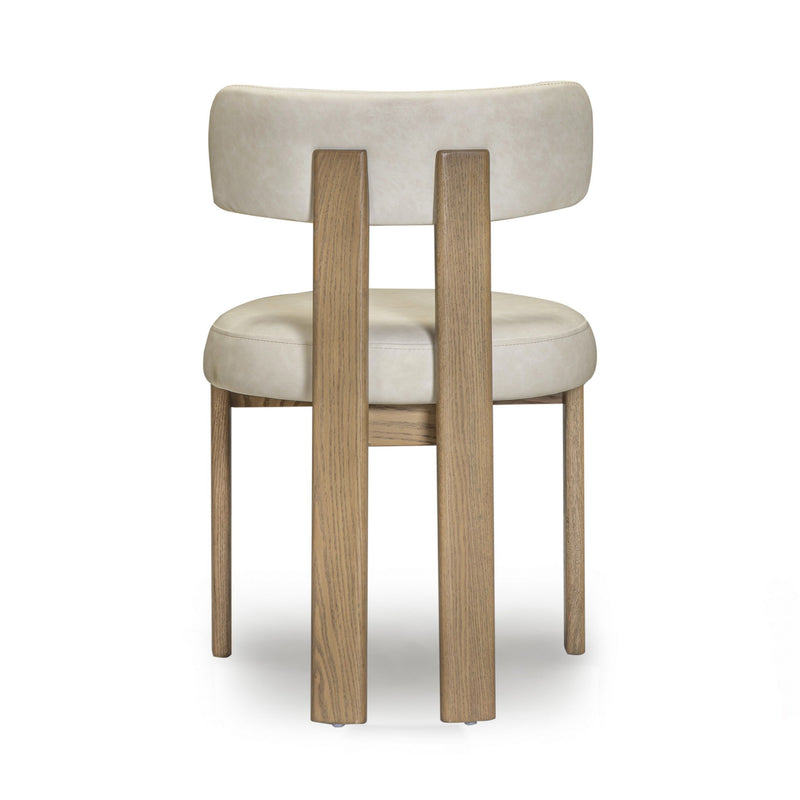 TOV Furniture Odessa dining side chair with upholstered seat and wooden legs, modern design for dining rooms.
