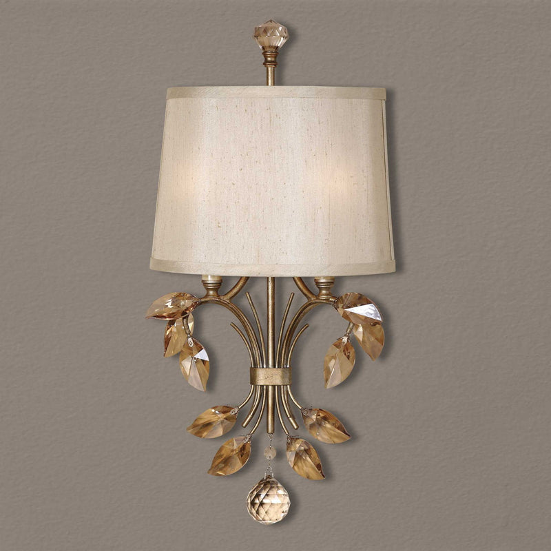 Uttermost Alenya 2 Light Gold Wall Sconce with sleek, modern design and elegant gold finish mounted on a wall.