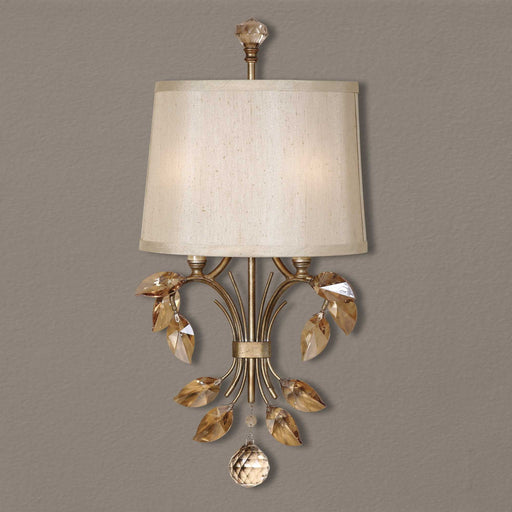 Uttermost Alenya 2 Light Gold Wall Sconce with sleek, modern design and elegant gold finish mounted on a wall.