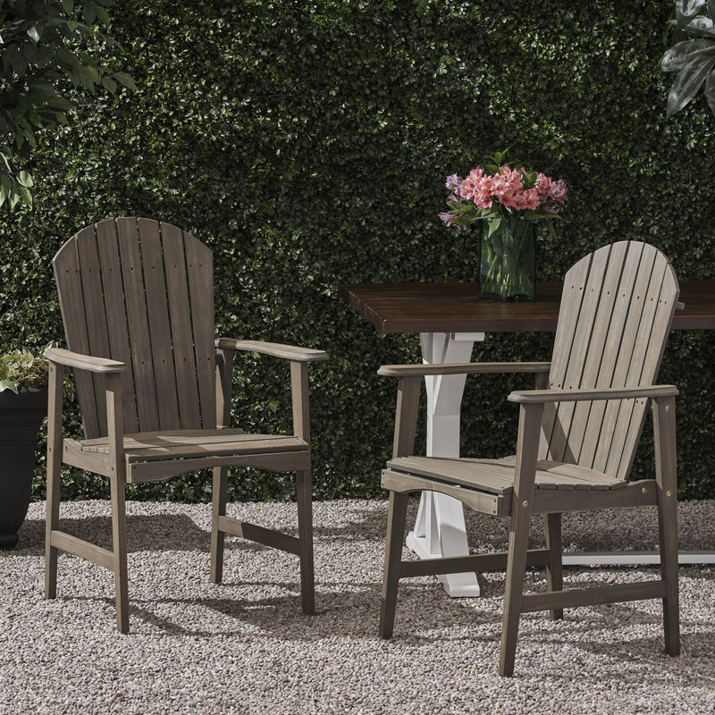 Pair of Noble House outdoor weather-resistant acacia wood Adirondack dining chairs set for patio or garden seating.