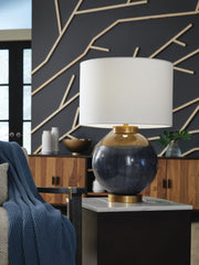 Blue and gold metal table lamp from Signature Design by Ashley® with a modern, sleek design and a cylindrical base.