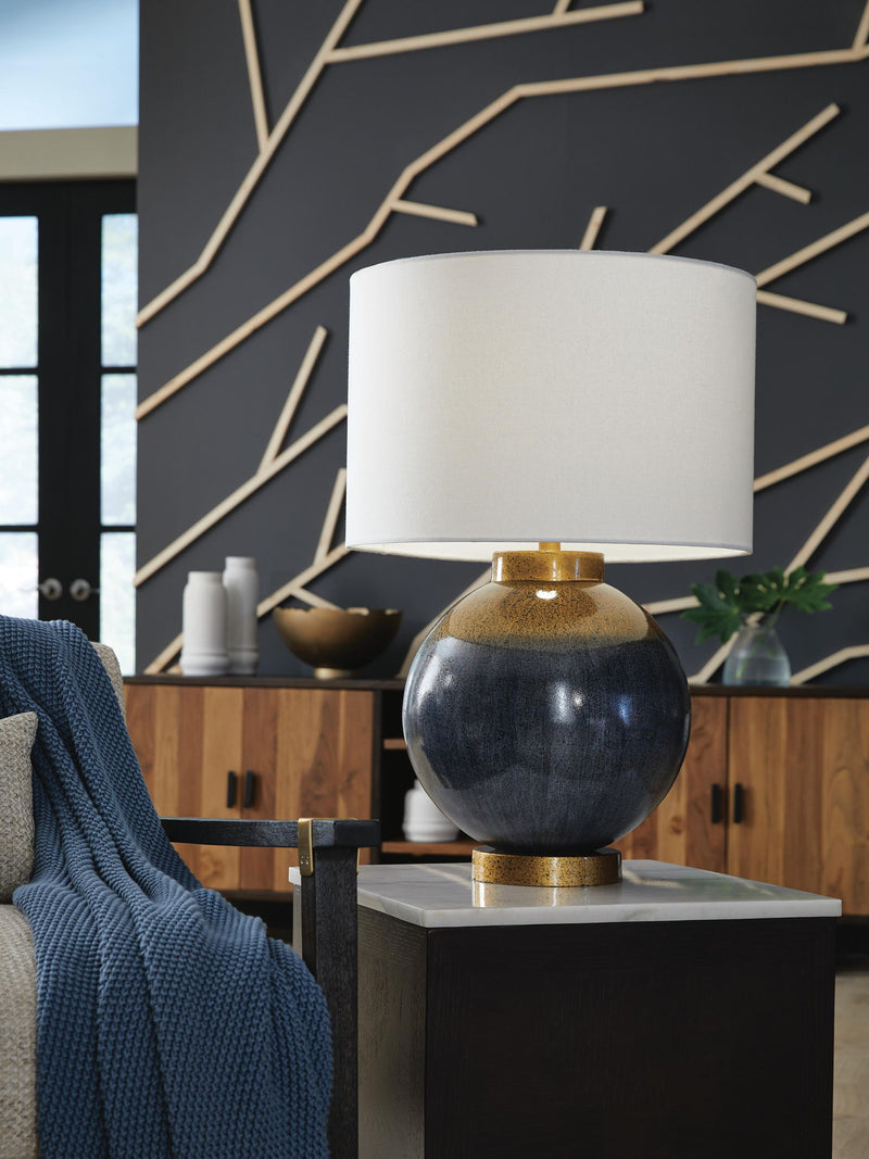 Blue and gold metal table lamp from Signature Design by Ashley® with a modern, sleek design and a cylindrical base.