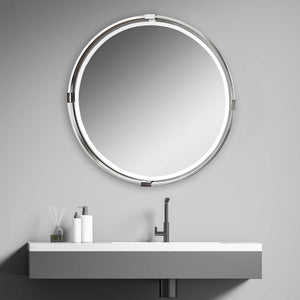 Uttermost Tazlina round wall mirror with brushed nickel frame, showcasing a sleek, modern design and reflective glass surface.
