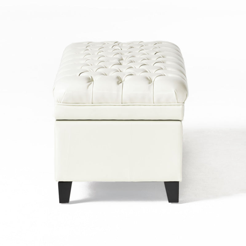 Noble House Juliana storage ottoman with birch legs, upholstered in fabric, showing a plush cushioned top and wooden legs.