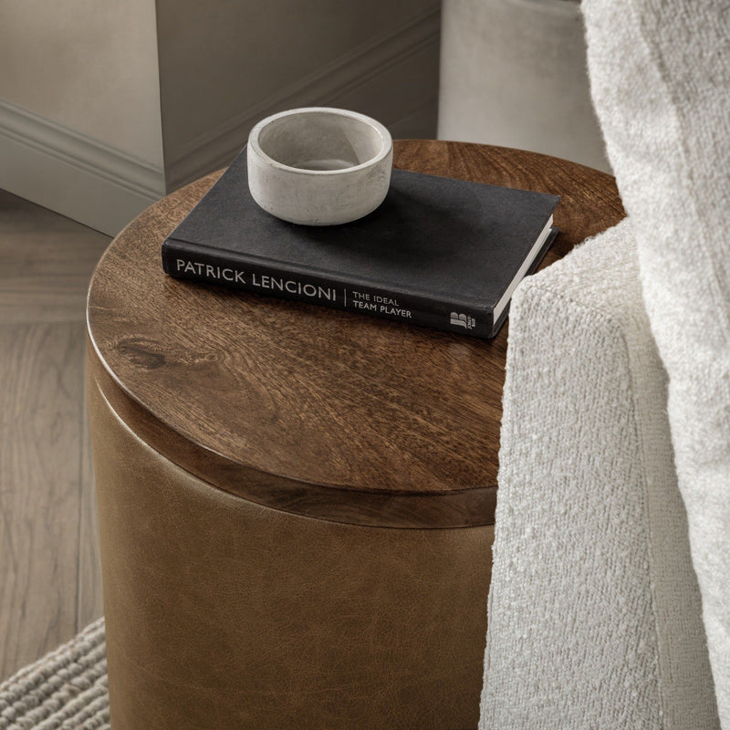 Classic Home Andra accent table with a round wooden top and metal legs, ideal for living room or bedroom decor.