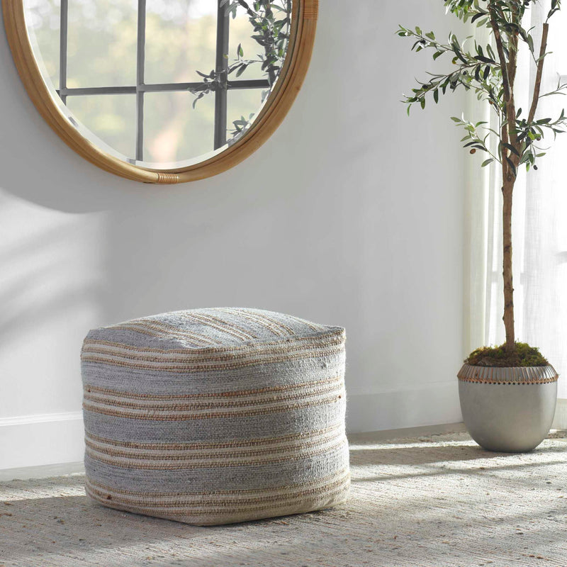 Gray handwoven accent pouf by Uttermost, Mesick collection, showing textured fabric and round shape suitable for living room décor.