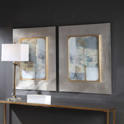 Set of two framed abstract prints by Uttermost titled Gilded Whimsy, featuring dark gray and gold accents for modern wall decor.