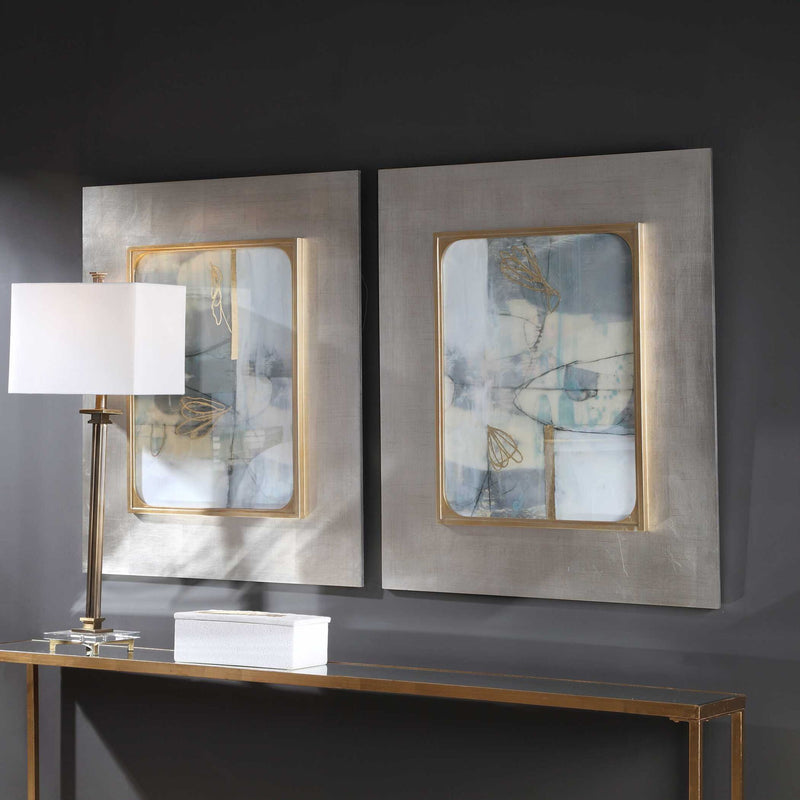 Set of two framed abstract prints by Uttermost titled Gilded Whimsy, featuring dark gray and gold accents for modern wall decor.