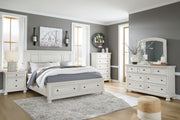 Robbinsdale Signature Design by Ashley 6-piece panel storage bedroom set with beds, dressers, and nightstands in a modern bedroom.