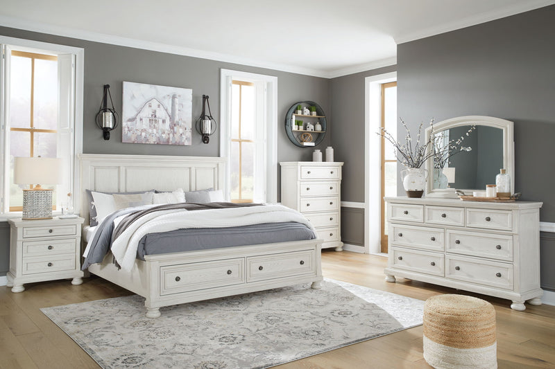 Robbinsdale Signature Design by Ashley 6-piece panel storage bedroom set with beds, dressers, and nightstands in a modern bedroom.