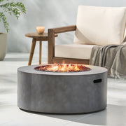 Round iron fire pit by Noble House with 40,000 Btu, featuring a sturdy design and a spacious top for outdoor fires.