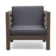 Noble House outdoor acacia wood patio arm chair with fabric cushion, showing a sturdy wooden frame and comfortable seating.