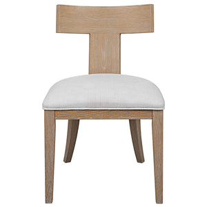 Uttermost Idris armless side chair with upholstered seat and wooden legs, modern design and neutral fabric for versatile decor.