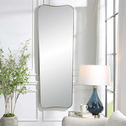 Large wall mirror by Uttermost with an antique brass finish, featuring a sleek, modern rectangular design for stylish interior decor.