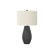 Contemporary black resin table lamp by 8th Street, featuring a sleek design and a modern lighting fixture for stylish home decor.