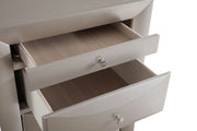 Glory Furniture Marilla 7 Drawer Lingerie Chest with sleek wooden finish and silver handles, showcasing its spacious drawers.