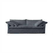 Classic Home Cassiano slip cover sofa with plush cushions and neutral fabric, showcasing a stylish stationary sofa design.