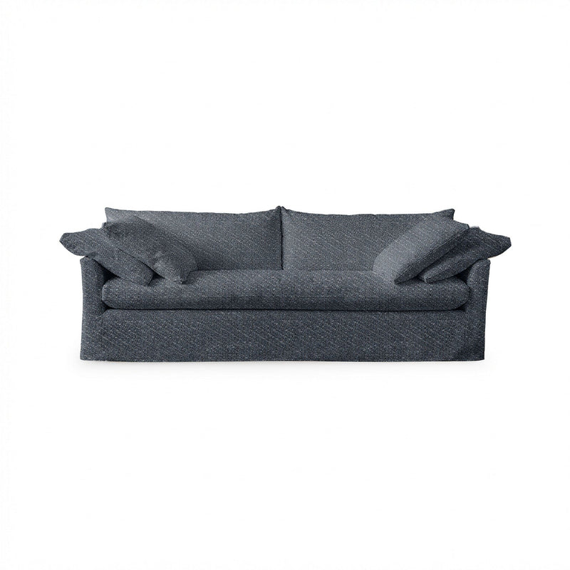 Classic Home Cassiano slip cover sofa with plush cushions and neutral fabric, showcasing a stylish stationary sofa design.