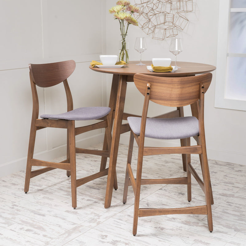 Noble House elegant counter height chair with cushioned seat and wooden legs, suitable for kitchen or bar area.
