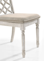 Set of two Lilola Home Havanna wide chairs with off-white cushions, featuring a modern design and sturdy frame.