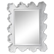 Uttermost Sea Coral wall mirror with intricate coral-inspired design, featuring a round shape and decorative frame.