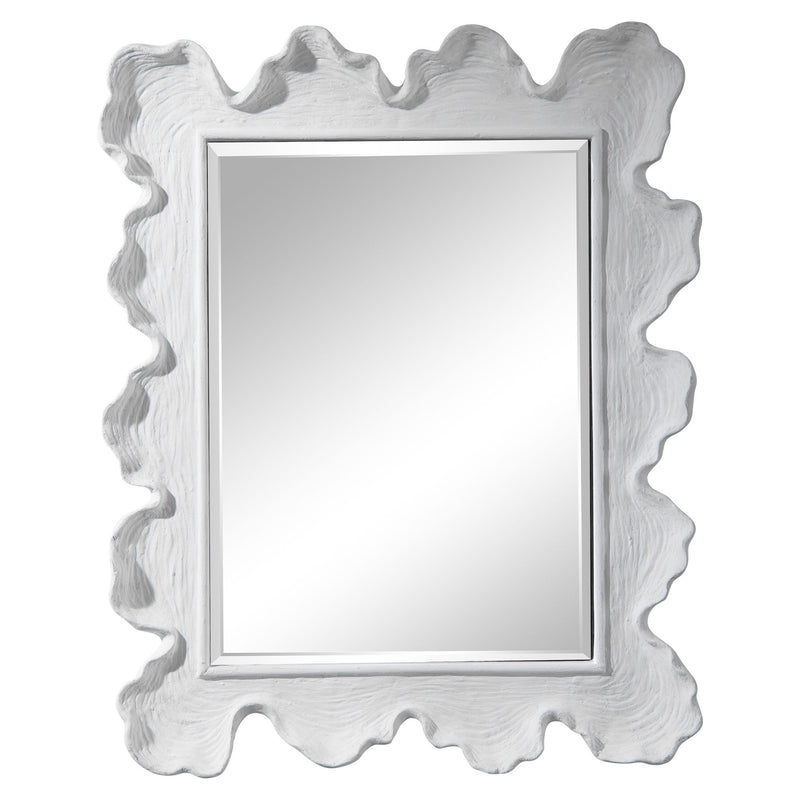 Uttermost Sea Coral wall mirror with intricate coral-inspired design, featuring a round shape and decorative frame.