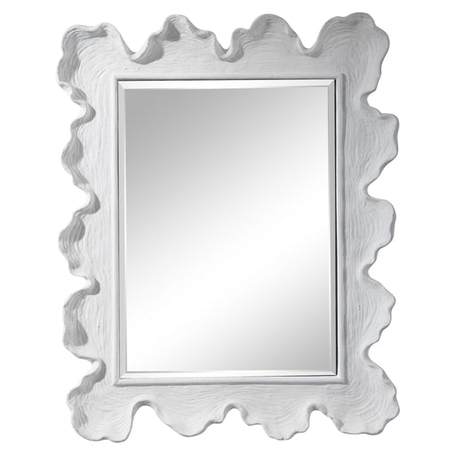 Uttermost Sea Coral wall mirror with intricate coral-inspired design, featuring a round shape and decorative frame.