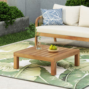 Square outdoor coffee table by Noble House with teak frame and slat top, ideal for patio or garden seating areas.