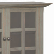 Medium handcrafted Acadian accent storage cabinet by Simpli-Home with wood finish and multiple storage compartments.