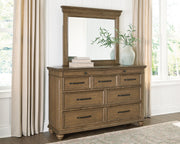 Signature Design by Ashley Karallin dresser with multiple drawers and a sleek wood finish for bedroom storage.