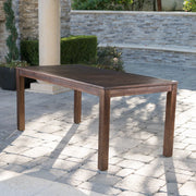 Dark brown acacia wood outdoor dining table with slatted top, ideal for garden or patio dining spaces by Noble House.