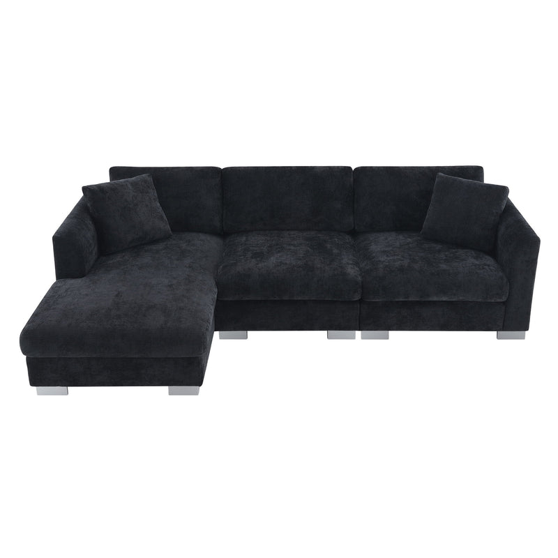 Luxe & Co. Modern L-shaped cloud sectional sofa with plush fabric, oversized chaise, and two decorative pillows in a contemporary living room.