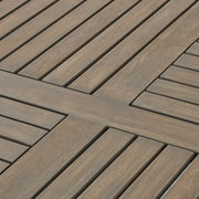 Hermosa outdoor acacia wood dining table with a circular design by Noble House, showing the textured wooden surface and sturdy base.