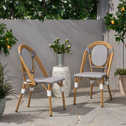 Noble House outdoor rattan and aluminum French bistro chair set with woven rattan seats and curved metal frames.