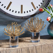 Pair of gold modern sculptures by Uttermost, featuring sleek abstract design, perfect for contemporary decor.