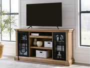 Signature Design by Ashley Wittenmyer TV stand with wood finish, open shelves, and storage compartments for media devices.
