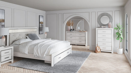 Seven-piece upholstered storage bedroom set by Signature Design Ashley®, including bed frame, nightstands, and dresser with fabric upholstery.
