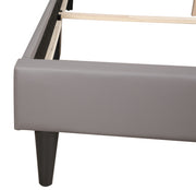 Two-tone upholstered bed from Glory Furniture, showcasing a modern design with a plush headboard and neutral fabric finish.