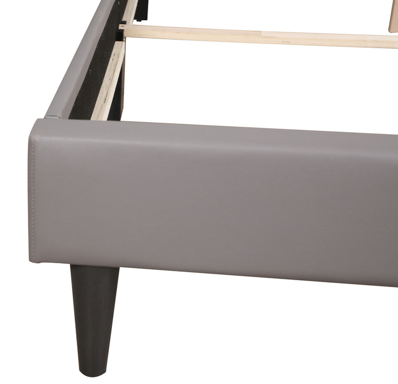 Two-tone upholstered bed from Glory Furniture, showcasing a modern design with a plush headboard and neutral fabric finish.