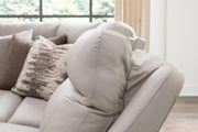Benchcraft® Gravier reclining sectional sofa with plush cushions and reclining seats, shown in a modern living room setting.