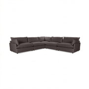 Classic Home Caplan modular sectional sofa with plush cushions and neutral fabric, showcasing its stylish stationary design.