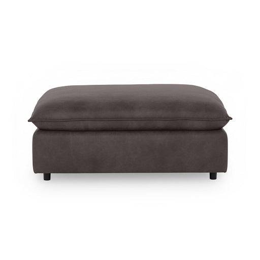 Classic Home Caplan upholstered ottoman with a plush fabric surface and wooden legs, perfect as a footrest or accent piece.