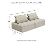 Signature Design by Ashley stationary sectional sofa with plush cushions and neutral fabric in a modern living room setting.
