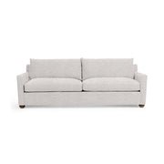 Olivia stationary sofa by Classic Home featuring plush beige upholstery and a comfortable, modern design.