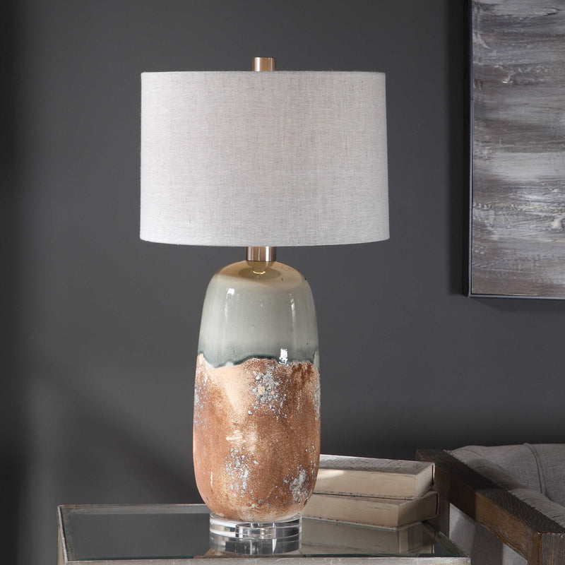 Uttermost Maggie ceramic table lamp in light brown with a smooth, rounded base and neutral fabric shade for elegant decor.