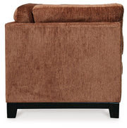 Ashley® Laylabrook plush upholstered sofa in bold spice color with dark wood trim, showcasing a comfortable stationary living room sofa.