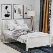 DreamHaus platform bed with wooden headboard, footboard, and slat support, showcasing a modern bedroom furniture design.