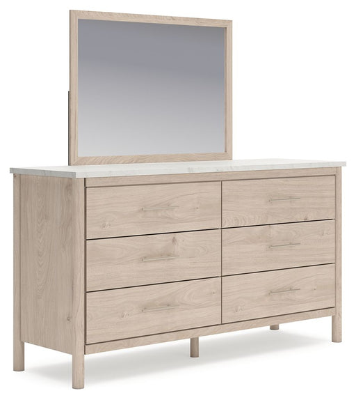 Signature Design by Ashley six-drawer dresser with a sleek wood finish and modern hardware, ideal for bedroom storage.